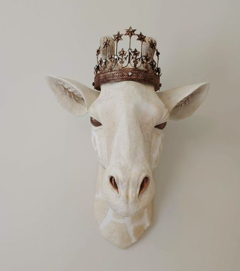 Crowned faux taxidermy giraffe head. Faux Animal Heads On Wall, Animal Heads On Wall, Faux Taxidermy Decor, Elephant Pottery, Star Tiara, Faux Animal Head, Animal Head Wall Decor, Taxidermy Decor, Head Wall Decor