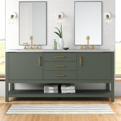 We love that this 72" double vanity set has plenty of storage and a clean-lined look that rounds out your modern bathroom or guest bath. Its freestanding frame is made from engineered wood in a neutral hue. The engineered stone surface accommodates the two included undermount ceramic sinks. Three soft-close drawers and two cabinet doors with sleek, gold-finished bars pull open up to reveal space for makeup, jewelry, and other toiletries. Plus, the open shelf on this vanity set is ideal for holdi Green Cabinets Bathroom Ideas, Traditional Double Vanity, Color Vanity Bathroom, Dark Green Bathroom Cabinets, Green Vanity Bathroom Ideas, Sage Green Bathroom Vanity, Double Bathroom Vanity Ideas, Bathroom Vanity Wood, Earthy Bathroom