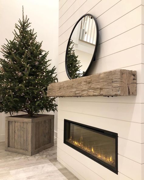 OUR MANTLE IS UP!!!! We finally have a fireplace mantle!! It took us half a day to install and we’ve waited nearly 4 months to get this but it is finally here and finally up and we LOVE it!!! This is a real old weathered hand-hewn barn beam (it actually has huge notches out of the back and underside that I actually love (I debated even having those face the front but ultimately decided on this cleaner look). It’s anchored to 5 studs by chunky steel brackets and bolts on the top and bottom ... A House We Built, Barn Beam Mantels, Beam Mantel, Wall Mounted Fireplace, Wall Mount Fireplace, Wood Mantle, Farmhouse Fireplace, Wood Mantels, Fireplace Ideas