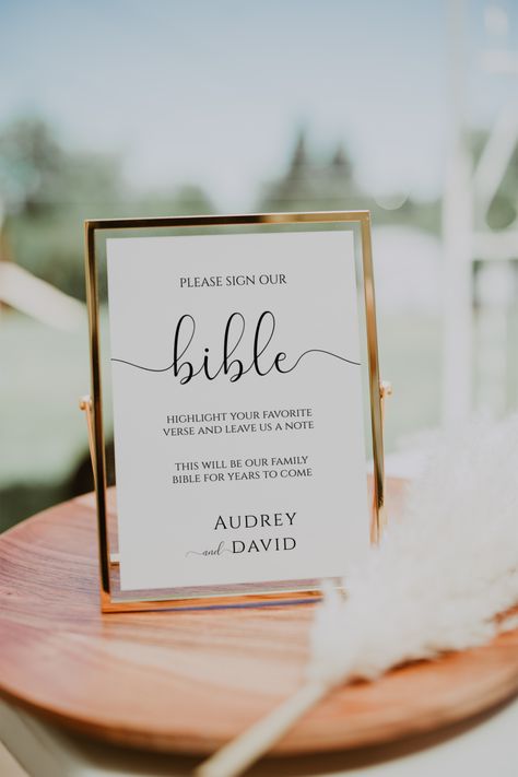 The Wedding Bible Guest Book Sign is perfect for your wedding! This bible guest book sign features a minimalist design that will make it one of a kind. Not only is this bible guest book sign beautiful, but it's also practical. This bible guest book sign makes a great addition to any wedding reception or ceremony.Comes in three sizes: 4x6 inch, 5x7 inch and 8x10 inch. All are easily editable and totally customizable.With this template you can change the fonts, text and colors. With each purchase I provide nine video tutorials on how to edit your items in Templett. There is NO software to download and NO fonts to install.TRY BEFORE YOU BUY - FOR FREE!Copy this link into your web browser to try out this template right now!https://templett.com/design/demo/ellawinstonpaperie/22715398,22715384,2 Signing Board For Wedding Guest Books, Wedding Gestures For Guests, Guest Book Bible Sign, Simple Timeless Wedding Decor, Small September Wedding, Washing Each Others Feet Wedding, Guest Bible Wedding, Favor Wedding Ideas, Sign The Bible Wedding