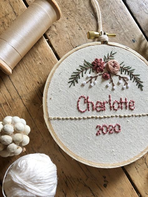 While sitting on my sofa, with a quilt on my lap, I will hand stitch this lovely embroidered hoop just for you or someone that you think is very special.  You can choose the name and year and the colours that you would like it to have. A beautiful keepsake for a child or grandchild that could be hung on a Christmas tree every year or kept out all year round in a bedroom or nursery.  Wonderful gift for a mew baby, baby shower, birthday or Christmas.  Can be set on a shelf or table, or hung with t Christmas Hand Embroidery, Embroidered Hoop, Towel Embroidery, Embroidery Tshirt, Name Embroidery, Purple Christmas, Baby Embroidery, Hand Stitch, Baby First Christmas Ornament