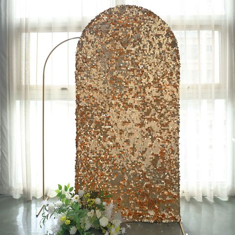 [About] Quantity: 1 Backdrop Stand Cover Material: Payette Sequins on Mesh Base Color: Gold Total Height: 7ft Total Width: 3.3ft Sequin Size: 18mm Custom Fit for our 7ft Round Top Wedding Arch Feature: Double-sided. Sequins on both sides. Pullover cover to get a snug fit [Information]Additional Information: Order is for Wedding Arch Cover only. Stands or other accessories are not included. Uses: Wedding Decoration, Ceremony, Party Decor, Baby Shower, Shopping Mall, Stores, Home Decor Chiara Backdrop, Speakeasy Party, Booth Decor, Sequin Backdrop, Shimmer Wall, Mall Stores, Backdrop Frame, Prom Theme, Indoor Ceremony