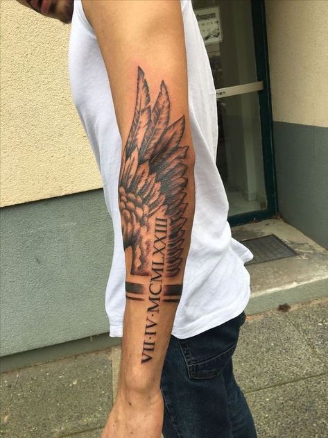 roman-numerals-arm-tattoo-fallen-angel-tattoo-angel-wing-man-with-white-top-jeans Tato Lengan Bawah, Side Arm Tattoos, Wing Tattoos On Back, Wing Tattoo Men, Tato Dengan Makna, Tattoo Placements, Back Of Arm Tattoo, Female Tattoos, Men Tattoos