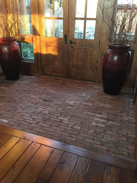 Brick To Hardwood Transition, Brick Flooring Transition To Wood, Rustic Brick Floor, Stone Brick Wood Interior, Polished Brick Floor, Brick And Wood Floor Transition, Old Brick Flooring, Brick And Wood Tile Floor, Brick Floor Kitchen Wood Cabinets