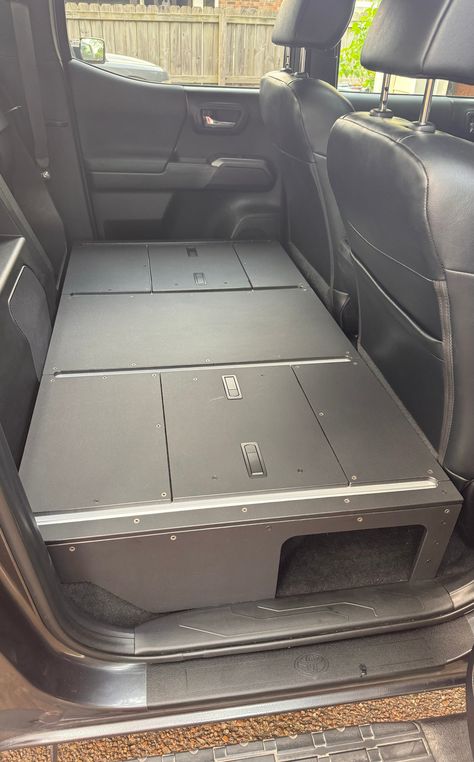 CargoKits Seat Delete This is a storage platform designed to replace either the 60% rear seat, or the full rear seats of a 2016-2023 Toyota Tacoma. The base platform has accessory rails built in for securing your gear or attaching modular drawers and kitchen slide outs. The in floor storage compartments are accessible through the access hatches. Features: Aluminum Construction for light weight without sacrificing strength. No plywood, HDPE sheets replace coated plywood that can eventually wear t Ram Interior, Rear Seat Delete, Tacoma Bed Rack, Tacoma 3rd Gen, Truck Storage Box, Truck Interior Accessories, Truck Bed Slide, Suv Storage, Toyota Tacoma Prerunner