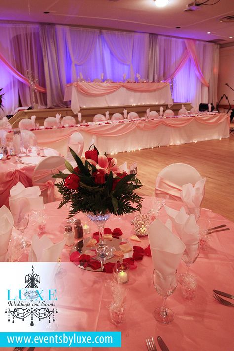 Pink and white quinceanera decor, martini glass centerpieces, red and pink rose centerpieces, pink uplighting, led centerpieces,short martini glass centerpieces, rose centerpieces, quinceanera decor, pink uplighting, pink wedding reception ideas, pink and white wedding backdrop, wedding backdrop ideas, backdrop draping, pink room ligting, pink decor ideas Red Pink And White Quince, Red And Pink Quinceanera Theme, Pink And Red Quinceanera Decorations, Pink And Red Quinceanera, Red And Pink Quinceanera Ideas, Red And Pink Quince, Quince Decorations Red, Pink Rose Centerpieces, Pink Quince Theme