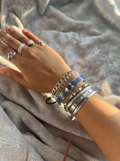 @Iwannag0t0plut0 Silver Rings Stacking, Luxury Bracelet Stack Silver, Hand Stacking Bracelet, Good And Silver Jewelry Together, Silver Jewelry Girl, Silver Bangle Stack, Stacked Rings Aesthetic Silver, Silver Jewelry Stack Bracelets, Chunky Silver Bracelets