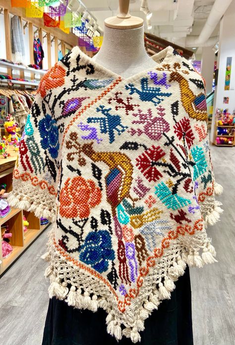 These beautiful Mexican ponchos (aka mañanitas) are handmade in Hueyapan Puebla. Every poncho bears unique hand-embroidery according to the traditions of the community. Measuring approximately 34" wide by 26'' long, one size should fit all adults. All ponchos can be worn 2 ways: Flat across the front or point down, for a longer, more flowing look. Mexican Inspired Outfit, Mexican Fits, Mexican Traditional Clothing, Mexican Clothes, Ballet Folklorico, Mexican Gifts, Poncho Design, Hispanic Culture, Fun Clothing