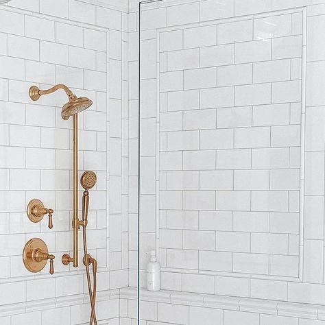 Erin Broege | theheartandhaven.com on Instagram: "Our shower! Subway tile is classic but I wanted to make it feel special. So, I added trim pieces in a picture moulding design to create interest and these stunning shower fixtures by @kohler to make it pop (the finish is called Vibrant Brushed Moderne Brass). The combo of the showerhead, handshower and slidebar in this color instantly elevated the design. Truly the epitome of form and function because it is so pretty to look at but I also LOVE Shower Subway Tile, Picture Moulding, Moulding Design, Kohler Artifacts, Picture Molding, Shower Fixtures, Subway Tile, Feel Special, Feeling Special