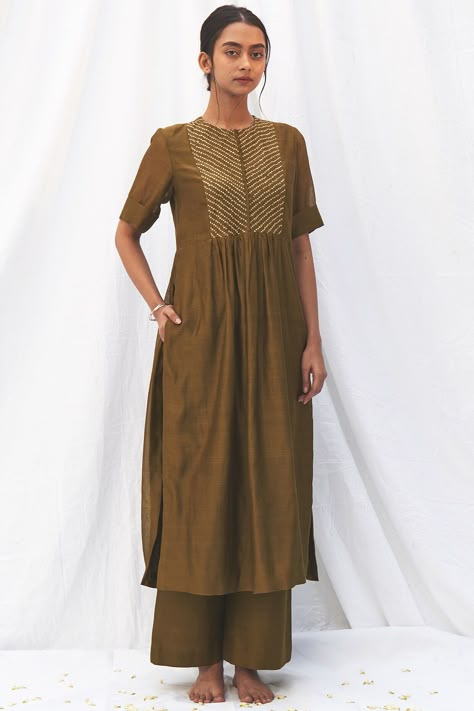 Featuring an olive green bandhej kurta in chanderi base with front opening and plain weave. It is paired with matching pants in cotton silk base.  FIT: Fitted at bust and waist. COMPOSITION: Chanderi, Cotton silk. CARE: Dry clean only. Plain Kurti, Chanderi Silk Suits, Angrakha Kurta, Silk Kurti Designs, Block Printed Suits, Designer Lehengas, Cotton Kurti Designs, Designer Anarkali, Kurti Designs Party Wear