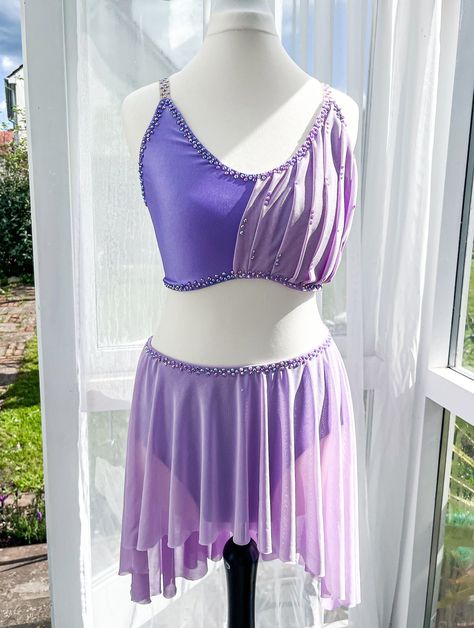 Brand new custom made lyrical dance costume  Lilac lyrical costume to fit age 10-14.  lavender Lycra lined top and bottoms with lilac mesh pleated overlay to top. lilac mesh full circle skirt with high low design.  High hip at the front and mid thigh length at the back This costume is so sparkly when the light catches it as it's covered in a/b lilac rinestones Will fit the following measurements  Chest 30" - 32" Waist 25" - 27" Hips 33" - 35" Rapunzel Dance, Lavender Costume, Lyrical Dresses, Dance Costumes Lyrical, Lyrical Costumes, Lyrical Dance, Full Circle Skirt, High Hips, Age 10