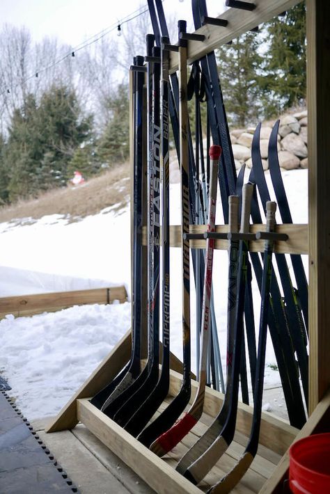 This is the second winter that we have built a backyard ice rink and I decided this year that we needed to get a handle on hockey stick storage rather than just leaning them against the house or piling them up on the ground. We also needed a place to store our cross country skis. I decided to build a freestanding hockey stick rack that would also hold the skis and poles on the other side. This way I could move everything into storage just like it is in the spring. I enjoy projects like… Hockey Stick Storage, Backyard Hockey Rink, Backyard Ice Rink, Backyard Rink, Hockey Diy, Outdoor Rink, Hockey Room, Hemma Diy, Ice Rink