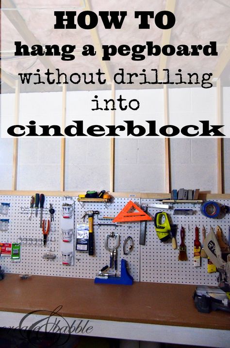 how-to-hang-pegboard-without-drilling-into-cinder-block-by-createandbabble.com Hang Pegboard, Hang Shelves, Basement Craft Rooms, Basement Paint Colors, Basement Organization, Basement Workshop, Garage Floor Paint, Cinder Block Walls, Hang Pictures