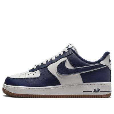 The Nike Air Force 1 '07 LV8 'College Pack Midnight Navy' is a classic silhouette with a modern twist. Featuring a white rear overlay with a chestnut-colored Swoosh, navy embroidery, and a double-knit pattern, this shoe is finished off with a fleece sock liner and a classic rubber sole. The sneaker is perfect for everyday wear, whether you're hitting the streets or the court. Inspired by the college lifestyle, this shoe is part of the College Pack series and is sure to turn heads. The iconic silver dubraes, color Nike Air branding, and navy nylon tongue complete the look. (AF1/SNKR/Skate/Men's/Light/Low Top/Non-Slip) Custom Air Force 1 Men, Navy Blue Nike Shoes, Dark Blue Shoes, Nike Shoes Blue, Nike Low Tops, College Lifestyle, Navy Embroidery, College Packing, Skate Man