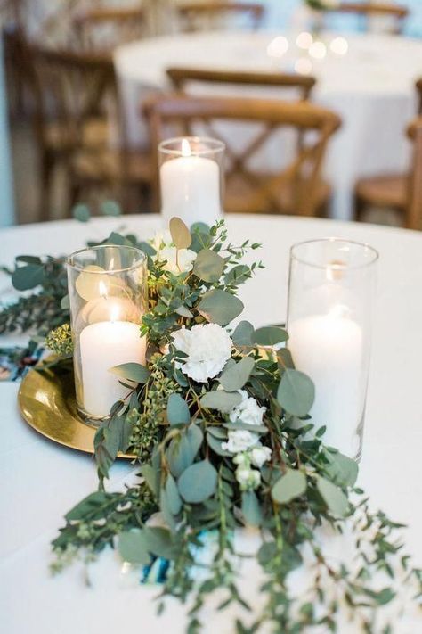 candle wedding centerpiece ideas Candle Eucalyptus Centerpiece, Wedding Tables With Eucalyptus, Wedding Eucalyptus Centerpieces, Green Wedding Table Centerpieces, Wedding Table Decorations Eucalyptus, Wedding Table Set Up Ideas, Eucalyptus Centerpiece Wedding, Centerpieces With Eucalyptus, Wedding Eucalyptus Decor