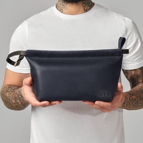 "Mens toiletry bag, Mens Dopp kit gift, Mens cosmetic bag, Mens accessory gift, Leather dopp kit, Leather toiletry bag, Leather wash bag Modern life is a bit messy, isn't it? The leather dopp kit will make it easier! Here are 3 simple steps on how: 1. get all your stuff out of shelf, table, bag, you name it :) 2. put it inside of personalized leather dopp kit with handle. 3. take it with you to feel confident in any situation! Whether you are planning a business trip, hiking, grill party or a simple city walk dopp kit will always be there with you! If you are looking for a practical and beautifully handcrafted gift this toiletry bag will do. DIMENSIONS Small: Width: 3\" / 7,6 cm Height: 6\" / 15.2 cm Length: 9\" / 22.8 cm Large: Width: 4\" / 10.1 cm Height: 7\" / 17.8 cm Length: 10\" / 25. Mens Dopp Kit, Leather Wash Bag, Stylish Leather Bags, Grill Party, Leather Dopp Kit, Mens Toiletry Bag, Leather Toiletry Bag, Shelf Table, Leather Passport Cover