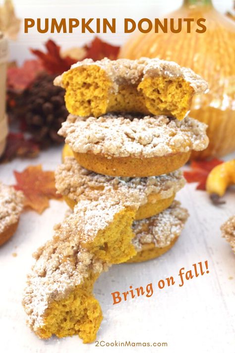 This Baked Pumpkin Donuts recipe is the perfect homemade treat for fall. Moist, full of spiced pumpkin flavor and topped with sweet cinnamon crumbs, you won't be able to stop at just one! They're quick and easy and make a great on-the-go breakfast or afternoon snack. #bakeddoughnuts #donutsrecipe #pumpkin #breakfast #homemade #fall #2CookinMamas Pumpkin Doughnuts, Pumpkin Donuts Recipe, Pumpkin Doughnut, Pumpkin Cheesecake Recipes, Yummy Fall Recipes, Spiced Pumpkin, Afternoon Snack, Baked Donuts, Crumb Topping