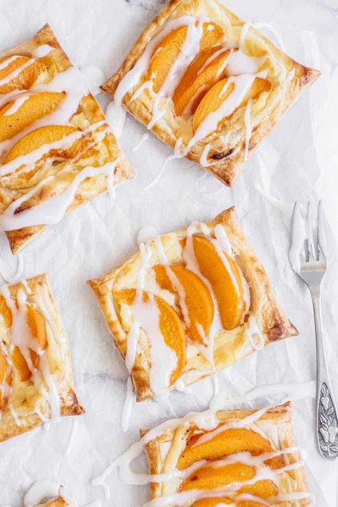 bird's eye view of peach danish pastries. Peach Danish, Peach Dessert Recipe, Peaches Cream Cheese, Blueberry Cake Filling, Cream Cheese Danish Recipe, Danish Pastries, Cheese Danish Recipe, Rough Puff Pastry, Cottage Food