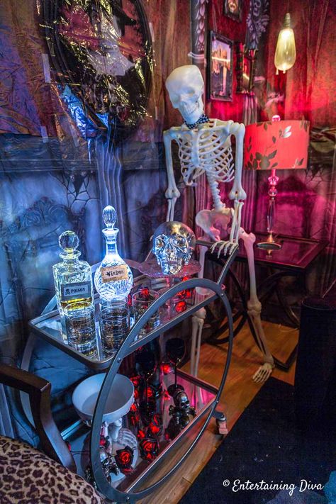 This Halloween bar cart is too cool! I love the DIY Halloween bottles with lights and labels and the skeleton bar tender. #entertainingdiva #halloweendecor  #halloween #halloweenindoordecor #halloweenindoordecor Party Bar Cart, Diy Halloween Bottles, Halloween Bar Cart, Halloween Party Decor Ideas, Halloween Party Bar, Halloween Bottle Labels, Bar Tender, Fun Diy Halloween Decorations, Halloween School Treats