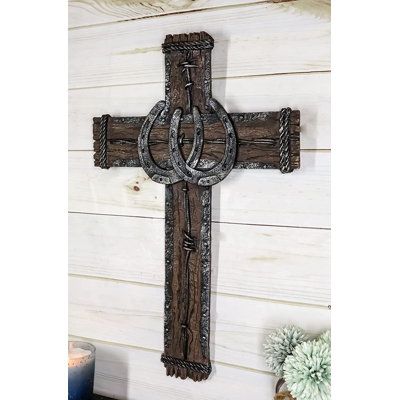 This Western Lucky Horseshoes Wall Cross is made of polyresin, hand painted and polished individually. | Trinx Elishka 2 Lucky Horseshoes Wall Decor in Brown / Gray, Size 19.25 H x 12.25 W x 0.75 D in | Wayfair | Home Decor Horseshoe Crosses, Horseshoe Cross, Spiritual Wall Decor, Horseshoe Projects, Cross Decor, Design Sculpture, Horseshoe Crafts, Cross Wall Decor, Wall Cross