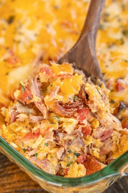 Pulled Pork King Ranch Casserole - a delicious twist on a classic Tex-Mex dish! This isn't fancy. It is just REALLY good!!! Pulled pork, cream of chicken soup, cream of mushroom soup, Cheez Whiz, Rotel tomatoes, hot sauce, Worcestershire sauce, tortilla chips, and shredded cheese. Can make in advance and refrigerate or freeze for later. Great for a potluck and tailgating! I never have any leftovers! #casserole #kingranch #texmex #freezermeal #pulledpork Pork Casserole Recipes, Pulled Pork Casserole, Pizza Raclette, King Ranch Casserole, Pulled Pork Leftover Recipes, Cheez Whiz, Pork Casserole, Ranch Casserole, Pulled Pork Leftovers