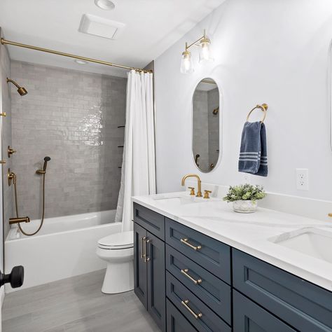 Navy, white, and gold 💙 what are your thoughts on a classic color palette like this in a bathroom? The vanity color is called Navy Masterpiece by @benjaminmoore 🏠 “Denim Blue House Tour” #bathroominspo #coastalbathroom #bluebathroom #bathroomstyle #goldbathroom Bathroom Floor Tile With Blue Vanity, Farmhouse Navy Bathroom, Navy And Silver Bathroom, Transitional Kids Bathroom, Blue Gray Bathroom Vanity, Dark Blue And Gold Bathroom, Navy Cabinets Bathroom, Gold And Navy Bathroom, Bathroom With Navy Vanity