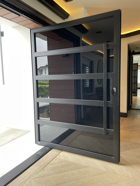 Custom aluminum and glass pivot door. Steel Door Design Front Entry, Aluminium Doors Entrance, Aluminum Entrance Door, Pivot Doors Entry, Pivot Entry Door, Aluminum Front Door, Entry Doors Modern, Glass Pivot Door, Contemporary Exterior Design