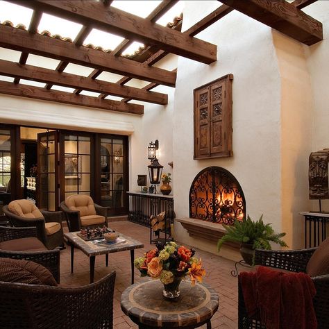 Higgins Architects | Our Spanish Colonial home on Valley Vista has this wonderful interior courtyard with a fireplace & trellis. Natural light is brought into… | Instagram Spanish Hacienda Interior Design, Spanish Hacienda Interior, Spain Style Home, Spanish Ranch Style Homes Interior, Spanish Colonial Patio, Spanish Style Home Living Room, Spanish Style Homes Interior Decor Living Room, Small Spanish Style Homes Interior Decor, Spanish Style Sunroom