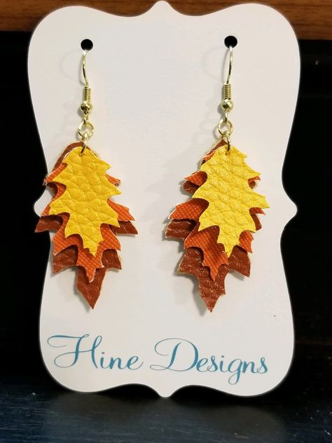 These super adorable earrings are made from faux leather and are constructed to look like a pile of fall leaves! Perfect for the entire fall season! Can come with your choice of yellow set or burgundy set! Other color combinations may be available upon request. Thanksgiving Faux Earrings, Faux Leather Earrings Fall, Thanksgiving Faux Leather Earrings, Fall Earrings Cricut, Faux Leather Halloween Earrings, Fall Leather Earrings, Faux Leather Earrings Cricut, Fall Faux Leather Earrings, Leather Earrings Cricut