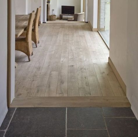 Wood Floor With Tile Transition, Wood Floor Meets Tile Kitchen, Hardwood Floors To Tile Transition, Wood Floor Next To Tile, Transitions Between Tile And Wood Floors, Kitchen Flooring Transition To Wood, Threshold Between Tile And Wood Floor, Modern Floor Transitions, Wood Floor Tile Transition