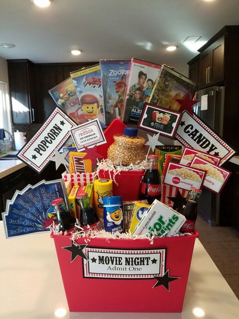 Movie Mania Gift Basket Family Movie Night Gift, Diy Christmas Gift Basket Ideas, Movie Basket, Movie Basket Gift, Diy Christmas Baskets, Movie Night Basket, Auction Gift Basket Ideas, Fundraiser Baskets, Budget Friendly Christmas Gifts