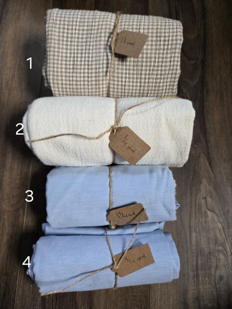 Your choice of fabric remnants! Perfect for small projects. Some remnants are end of bolts and may have an uneven cut.  Approximately 54" wide. 1- tan/white checked (cotton linen)- 1 1/3 yards 2- ivory cotton gauze- 3/4 yard 3- sky blue (linen/rayon) 1 1/4 yards 4- sky blue (linen/rayon) 3/4 yard Keep in mind that different monitors can display colors differently. Small Projects, Fabric Remnants, Textured Knit, Cotton Linen, Linen Blend, Sky Blue, Yard, Texture, Knitting