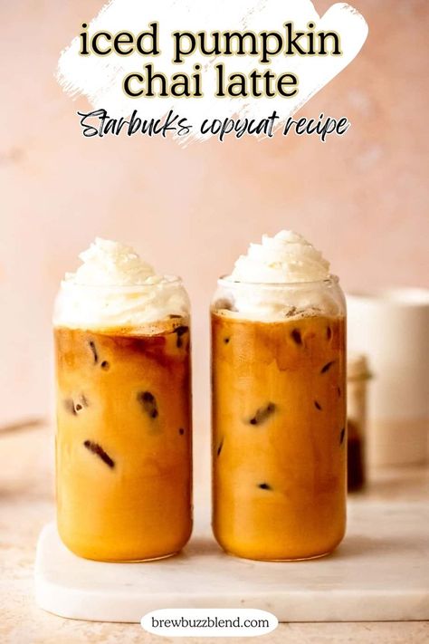 Two iced pumpkin chai lattes topped with whipped cream sitting on a marble slab. Pumpkin Chai Latte Starbucks, Pumpkin Spice Tea Recipe, Flavored Latte Recipes, Pumpkin Spice Chai Latte Recipe, Pumpkin Chai Tea Latte, Iced Chai Latte Starbucks, Starbucks Chai Tea Latte Recipe, Pumpkin Chai Latte Recipe, Chai Latte Starbucks