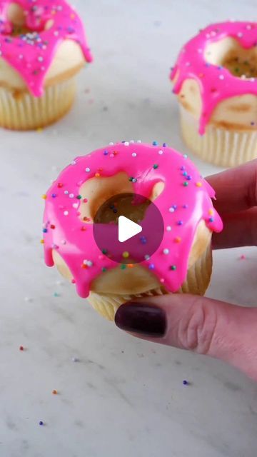 Coty Beth on Instagram: "Drippy iced donut cupcakes 🍩 I made the "donut" top with buttercream (freeze for ~15 manager placing cupcake on top), and dusted it with cocoa powder. Pink icing is ganache! #cupcakes #cupcakedecorating #donuts #cakehacks #cupcake" Donut Ideas For Birthday, Donut Cupcake Cake, Donut Theme Cupcakes, Donut Themed Cupcakes, Donut Cupcakes Ideas, Ganache Cupcakes, Dozen Donuts, Donut Cupcakes, Donut Themed Birthday Party