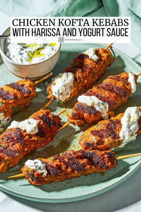 Spicy chicken kofta kebab recipe with ground chicken, harissa, and garlicky mint yogurt sauce. A flavor-packed grilled chicken recipe! Chicken Kofta Kebab, Ground Chicken Kebab Recipe, Chicken Harissa, Recipe With Ground Chicken, Chicken Kofta Recipe, Kofta Kebab, Chicken Kofta, Mint Yogurt Sauce, Grilled Chicken Recipe