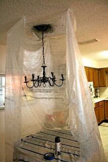 Spray paint chandelier while hanging Spray Painted Chandelier, Spray Painting Light Fixtures, Spray Painting Wood Furniture, Framed Doilies, Painting Light Fixtures, Painted Chandelier, Ceiling Fan Makeover, Chandelier Makeover, Plastic Bottle Art