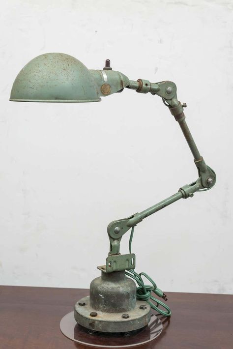 For Sale on 1stdibs - American Industrial lamp. Steel and old paint on a solid bronze base. Possible U S (no labels) government issue, circa 1940-1950. The height and reach Vintage Industrial Lamp, Old Table Lamp, Industrial Set Design, Industrial Objects, Aesthetic Industrial, Industrial Lamp Design, Warehouse Lighting, Punk Decor, Type Of Lighting