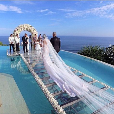 Beautiful ocean seaside wedding  Aisle is glass over water of infinity pool.  Location: Tropical island in Caribbean or pacific ocean... maybe Maldives or Hawaii  “Tag your love ❤️ | Photo: ©️️Monica Hannoun | Follow /lux/.toys” Pool Wedding, Water Wedding, Walk Down The Aisle, Beach Ceremony, Bali Wedding, Seaside Wedding, Wedding Aisle, Wedding Goals, Wedding Cake Designs