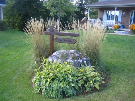 Need to do something like this at end of driveway around the rocks. Large Yard Landscaping, Driveway Entrance Landscaping, Driveway Entrance, Driveway Landscaping, Front Landscaping, Garden Yard Ideas, Landscaping Tips, House Landscape, Garden Photos