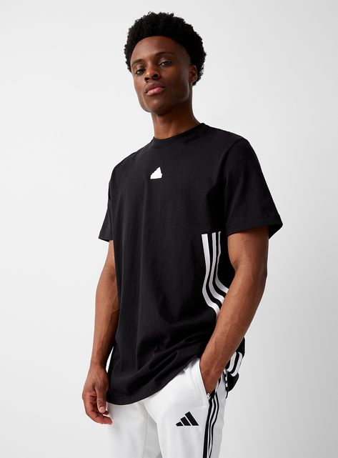 Activewear > Men > Trainingbr>Adidas - Future Icons white-on-black accent longline tee Adidasbr>ul>li>adidas at I.FIV5/li>li>A casual basic featuring a monochrome silicone "Badge of Sport" and three signature bands on the side/li>li>Ultra comfortable, soft and stretch 100% cotton jersey/li>li>Ribbed crew neck/li>li>Long relaxed fit/li>/ul>br>br>The size of the item pictured is medium Training Tops, Sports Training, Black Set, Mens Sportswear, Black Accents, Mens Activewear, Gym Wear, Athletic Wear, Workout Gear