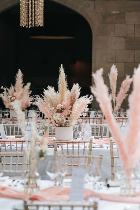 Boho luxe wedding with pink and white pampas grass table centrepieces and decor Flower And Pampas Centerpieces, Boho Pink Wedding Decorations, Pink Boho Table Decor, Pampas Grass Top Table, Pink Pampas Wedding Decor, Pampas Grass Centre Piece, Dry Flower Wedding Decor, Pink Pampas Centerpiece, Pampas Wedding Decor Table