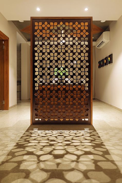 Floral Pattern Inspires Apartment Interiors | Studio 7 - The Architects Diary Hiasan Dalaman Rumah, Wall Partition Design, Wall Partition, Wooden Partitions, Jaali Design, Furniture Design Inspiration, Pooja Room Door Design, Pooja Room Design, Wooden Screen