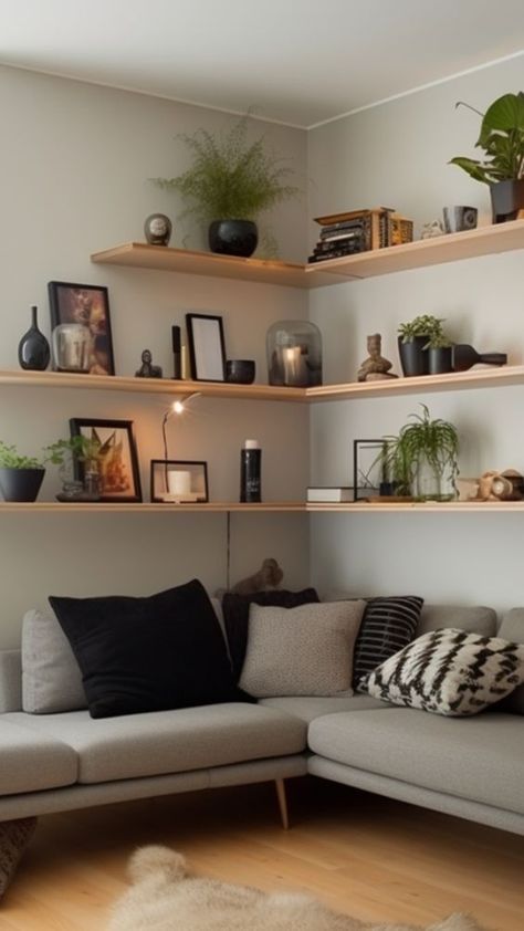 Corner Shelves Sofa, Living Room Extra Wall Ideas, Shelves In Corner Living Room, Sitting Room Shelves Ideas, Book Shelves Over Couch, Utilizing Vertical Space, Vertical Shelves Living Room, Bookshelf Corner Living Room, Corner Picture Shelves