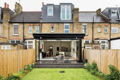 A single-storey rear extension to this terraced house in Wimbledon has created an open-plan kitchen-living-diner. Planning permission was sought for a 4m-long design with bi-fold doors and skylights. | #homedesign #interiorinspo #renovation #homedecorideas #dreamhome #homeremodel #interiordesign #kitchenextension #singlestorey #kitchenextensions #kitcheninspo #dreamkitchen #kitchendecor #crittallstyle #crittalldoor #glazing #storageideas #stoarge #kitchenstorage #kbbmag Extension Ideas Open Plan, Victorian Terrace Kitchen Extension, Terraced House Kitchen, Terrace Kitchen Extension, Victorian Terrace Kitchen, Rear Kitchen Extension, Wraparound Extension, Flat Roof Tiles, Terrace Extension