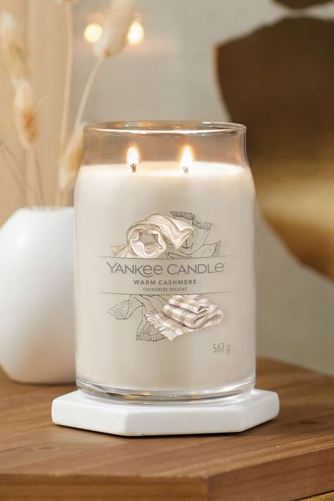 Wrap yourself in luxury with sumptuous notes of calming sandalwood and exotic patchouli. Top: Sun Kissed Orange. Mid: Cashmere Wood, Golden Amber, Cardamom. Base: Creamy Sandalwood, Sueded Musk, White Patchouli, Vanilla. Experience the Yankee Candle brand, totally reimagined. This refreshing take on our iconic Jar shape is designed to create the best experience to date. This is the largest Jar Candle in the collection at 567g. Two wicks and a premium soy-wax blend provide beautiful ambiance. Han Neutral Candles, Candle Yankee, Cozy Candle, Candle Luxury, Candles Luxury, Yankee Candle Jars, Empty Candle, Candle Obsession, Candle Brand