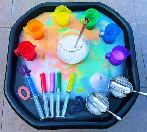 Rainbow Water 🌈 - Water play - Colour mixing - Creative play - Number recognition 🌈 The base is water and white paint 🌈 I then added a little of each coloured water to the base to create a rainbow effect 🌈 Coloured jugs and rainbow numbers from @tickit_education ⭐️ Follow for more water play activities #tufftray #tufftrayideas #tufftrayactivities #tufftrayplay #tufftrayfun #tuffspot #tuffspotideas #playtray #playtrayideas #playtrayactivities #waterplay #messyplay #sensoryplay #number... Colours Sensory Play, Nursery Water Tray Ideas, Colour Mixing Display Eyfs, Outside Water Play, Rainbow Messy Play, Invitations To Play Preschool, Rainbow Tuff Tray, Rainbow Theme Preschool Activities, Colour Activity For Toddlers