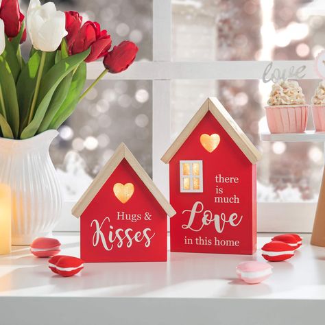 "Get thisGlitzhome® Lighted Valentine's Wooden House Table Décor Set at Michaels. com. You can put them on the desk or shelf, also as a gift to your loved ones, family or friends. Sincere love comes together to form this set of Valentine's Day table decorations. You can put them on a desk or shelf, or gift them to your loved ones, family or friends. Details: Red love house designs Set of 2 4 AAA batteries required (not included) MDF, wood and LED For indoor use only Size Information: Small house Valentine's Tree, Valentine Day Table Decorations, Wooden Roses, Valentines Gift Tags, Engagement Party Gifts, Coffee Valentines, Valentines Ideas, Holiday Store, Up House