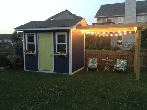 The shed and pergola are coming along nicely! Can't wait to put in the patio and surrounding gardens next spring! (Photo only.) Two Sheds In Backyard, Shed Pergola Combo, Pergola Shed Combo, Pergola Off Shed, Pergola Attached To Shed, Backyard Landscaping With Shed, Shed With Pergola Attached, Shed Patio Ideas, Shed With Overhang