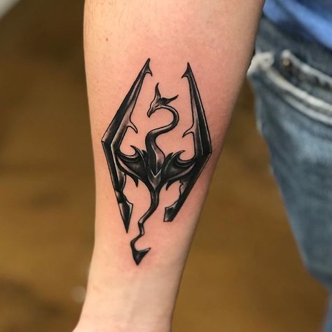 #Tattoos,skyrim tattoo Dogmeat Tattoo, Skyrim Tattoo Design, Skyrim Logo Tattoo, Skyrim Symbol Tattoo, Video Game Tattoo Ideas For Men, Skyrim Tattoo Sleeve, Alduin Skyrim Tattoo, Skyrim Dragon Tattoo, Sandevistan Tattoo