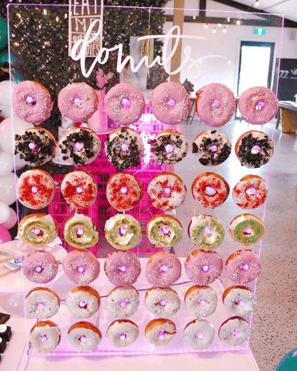 A Donut-licious Themed Quinceanera Quinceanera Ideas Themes Unique, Donut Walls, Doughnut Wall, Acrylic Backdrop, Quince Themes, Sweet 16 Themes, Quinceanera Favors, Quinceanera Planning, Donut Bar